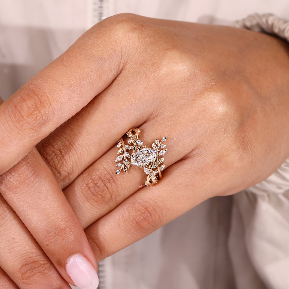 Avideri diamond bridal set with marquise center stone.
