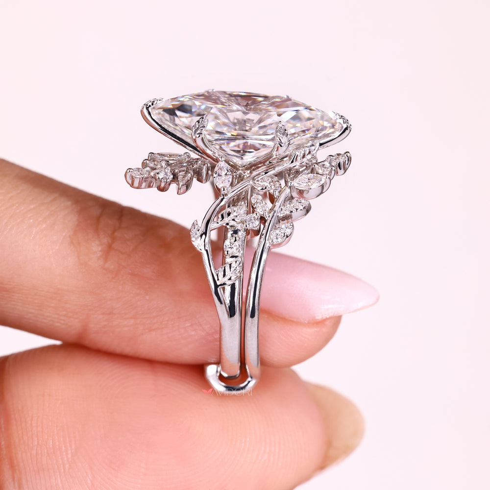 Nature inspired marquise ring with side stones.
