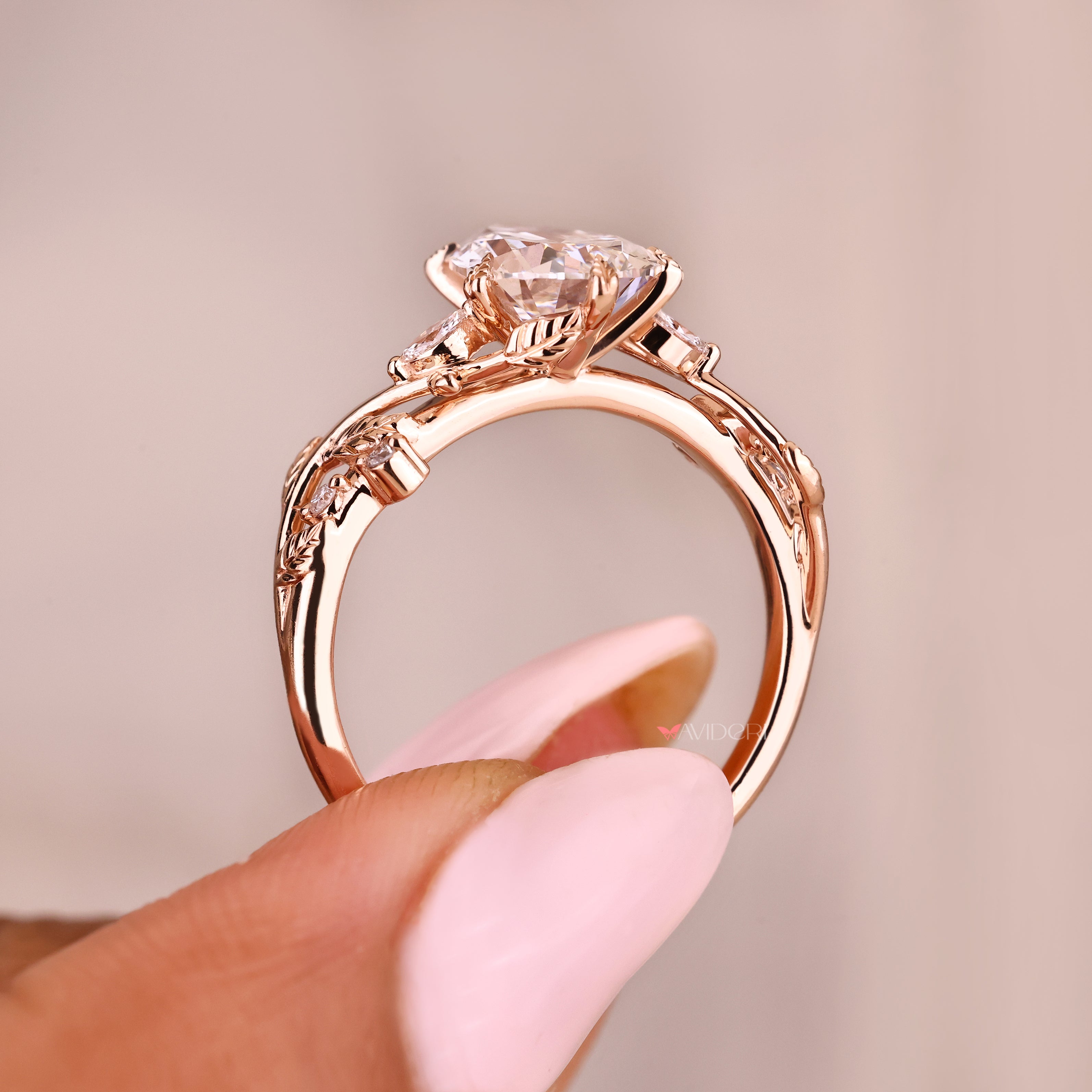 Lab grown pear diamond ring with marquise side accents
