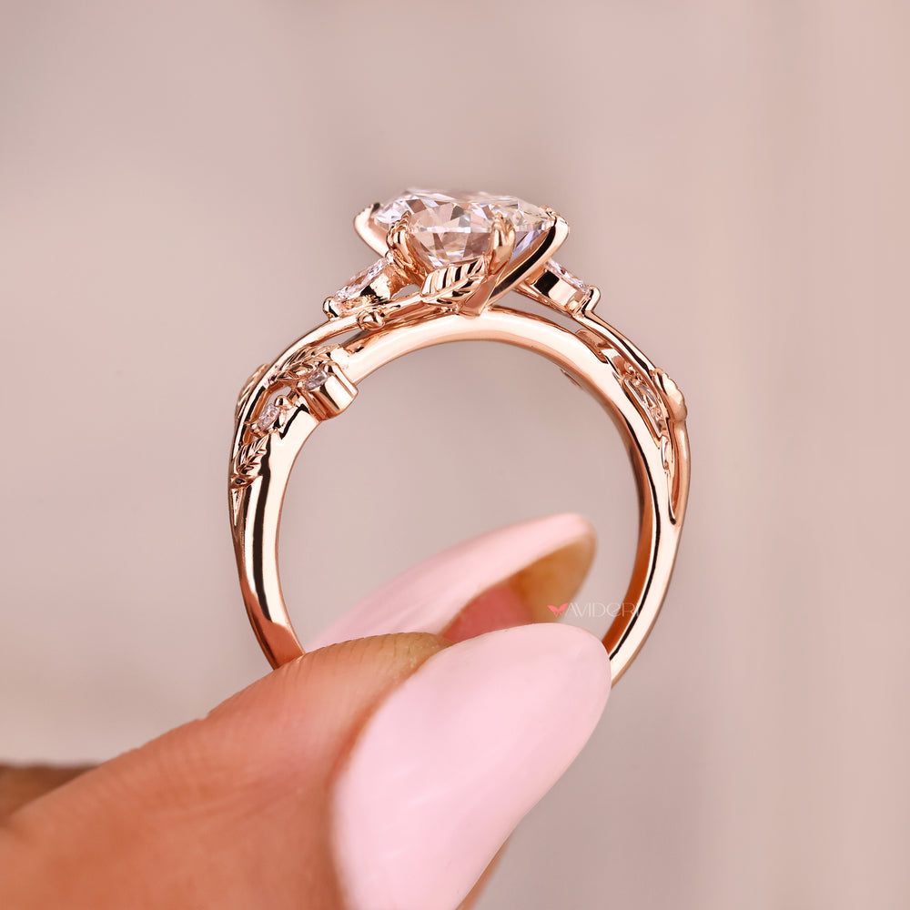 Lab grown pear diamond ring with marquise side accents
