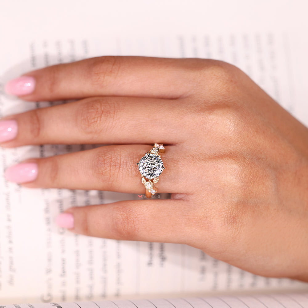 Handmade Portuguese cut diamond ring with round and marquise accents in six claw prong setting

