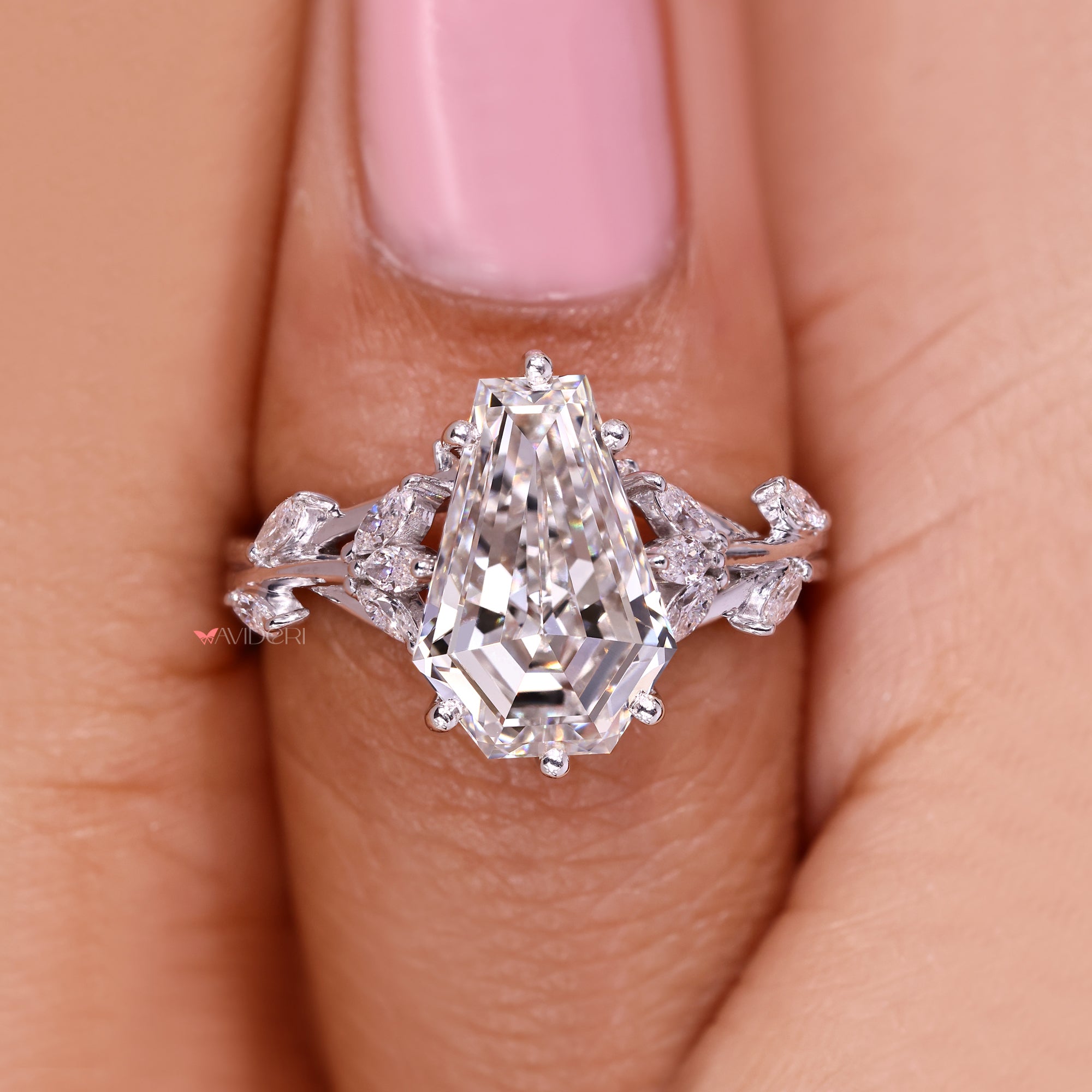 Handmade coffin cut diamond ring with side stones.
