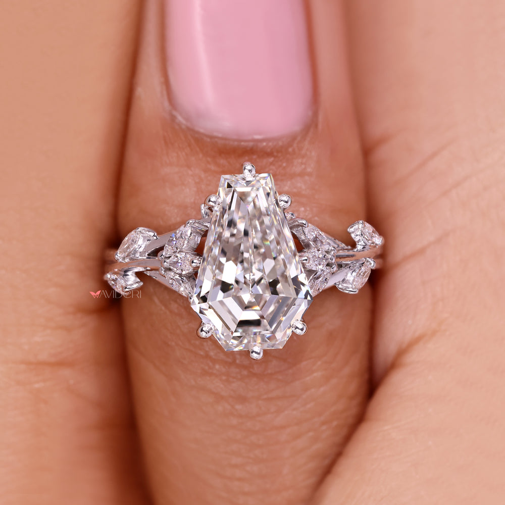 Handmade coffin cut diamond ring with side stones.
