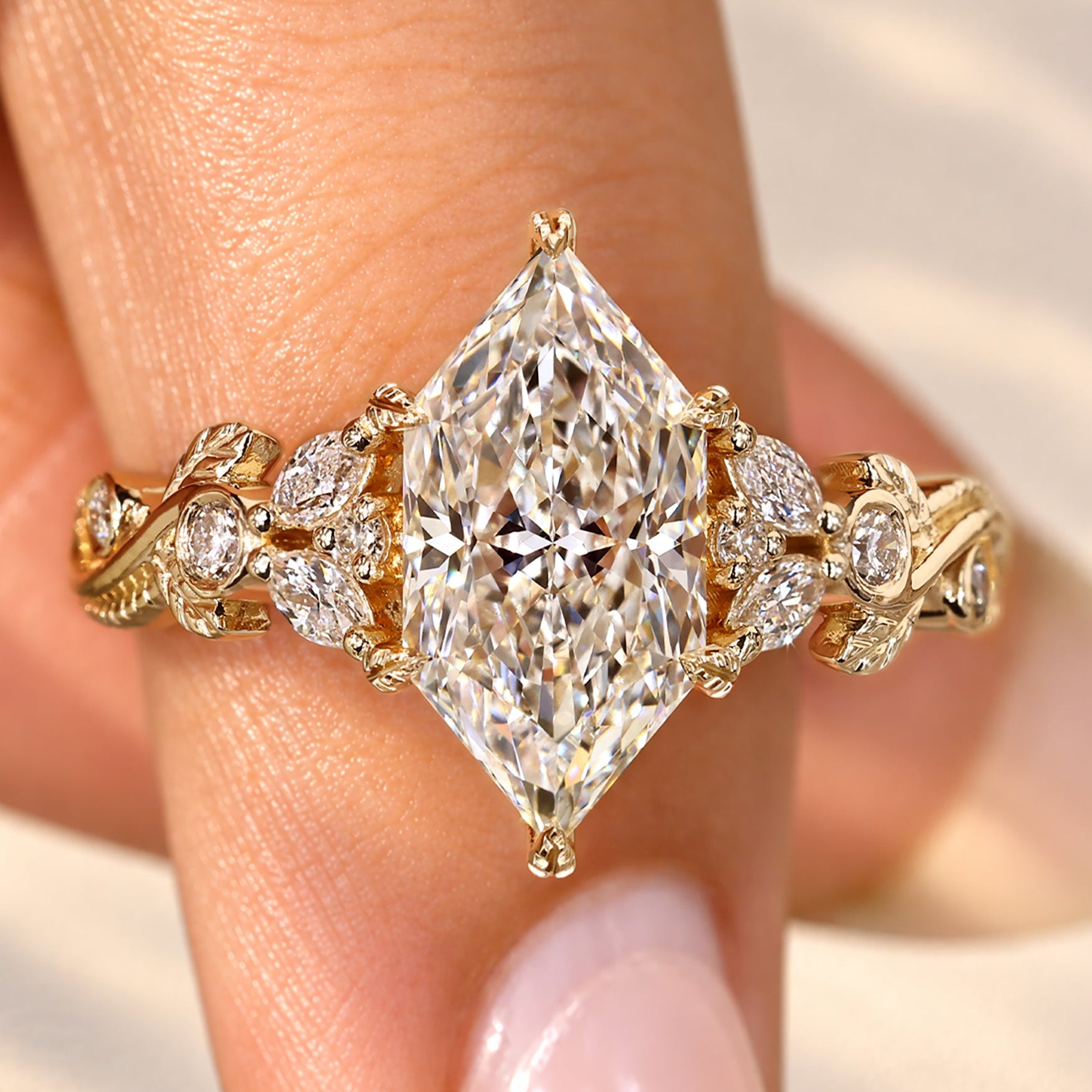 Dutch marquise diamond ring with round side stones.
