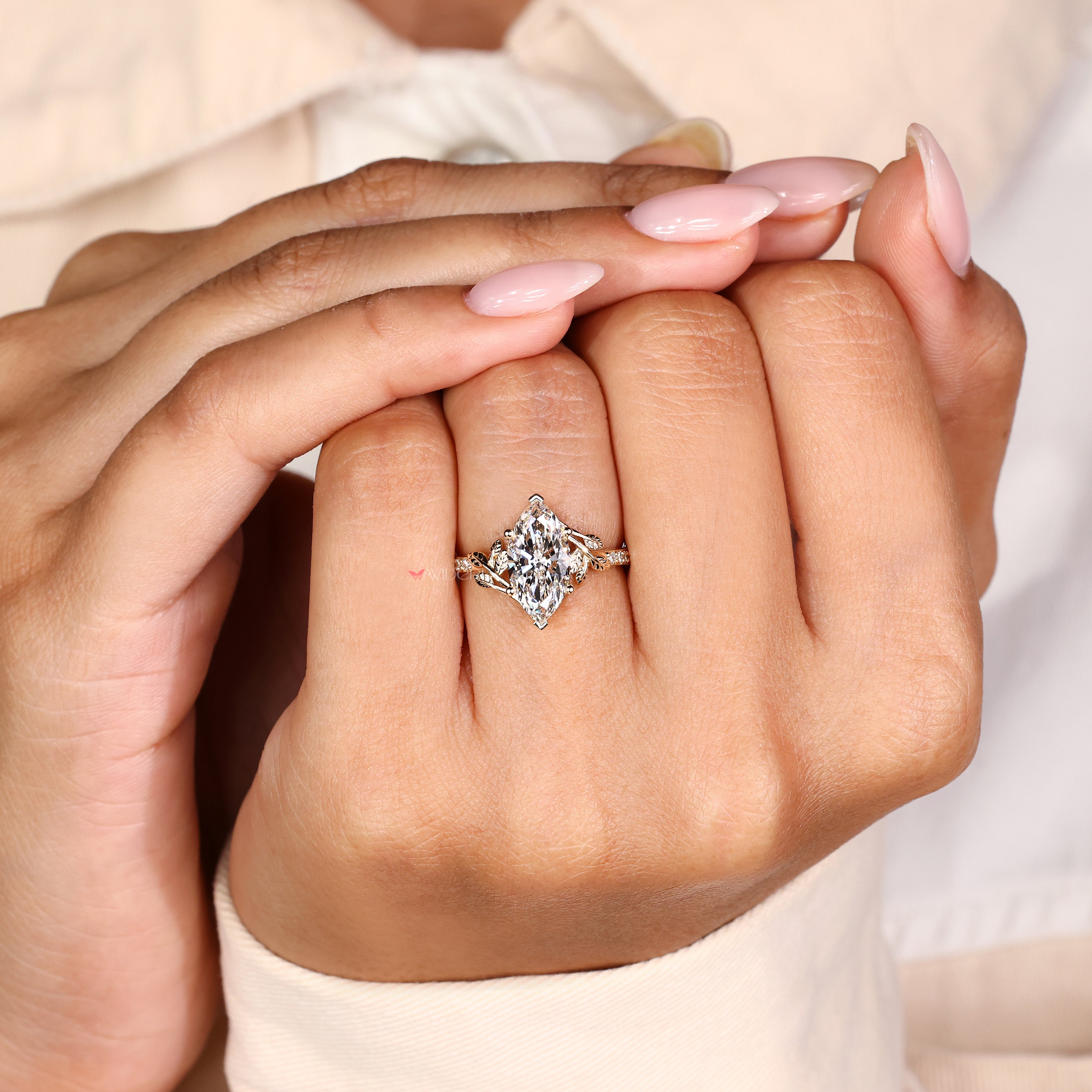 Marquise diamond ring with leaf structure and round diamonds
