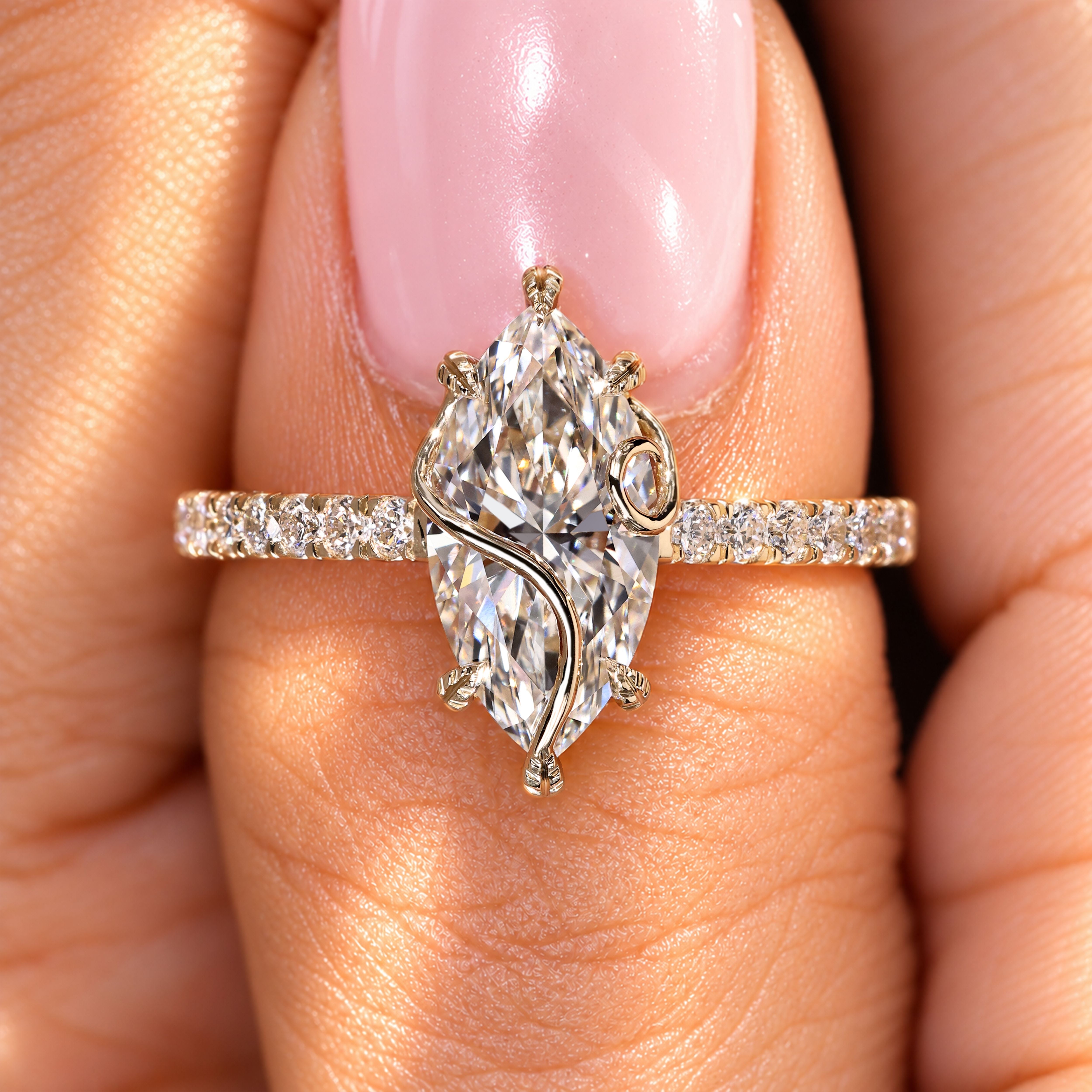 Nature inspired marquise ring with round diamonds.
