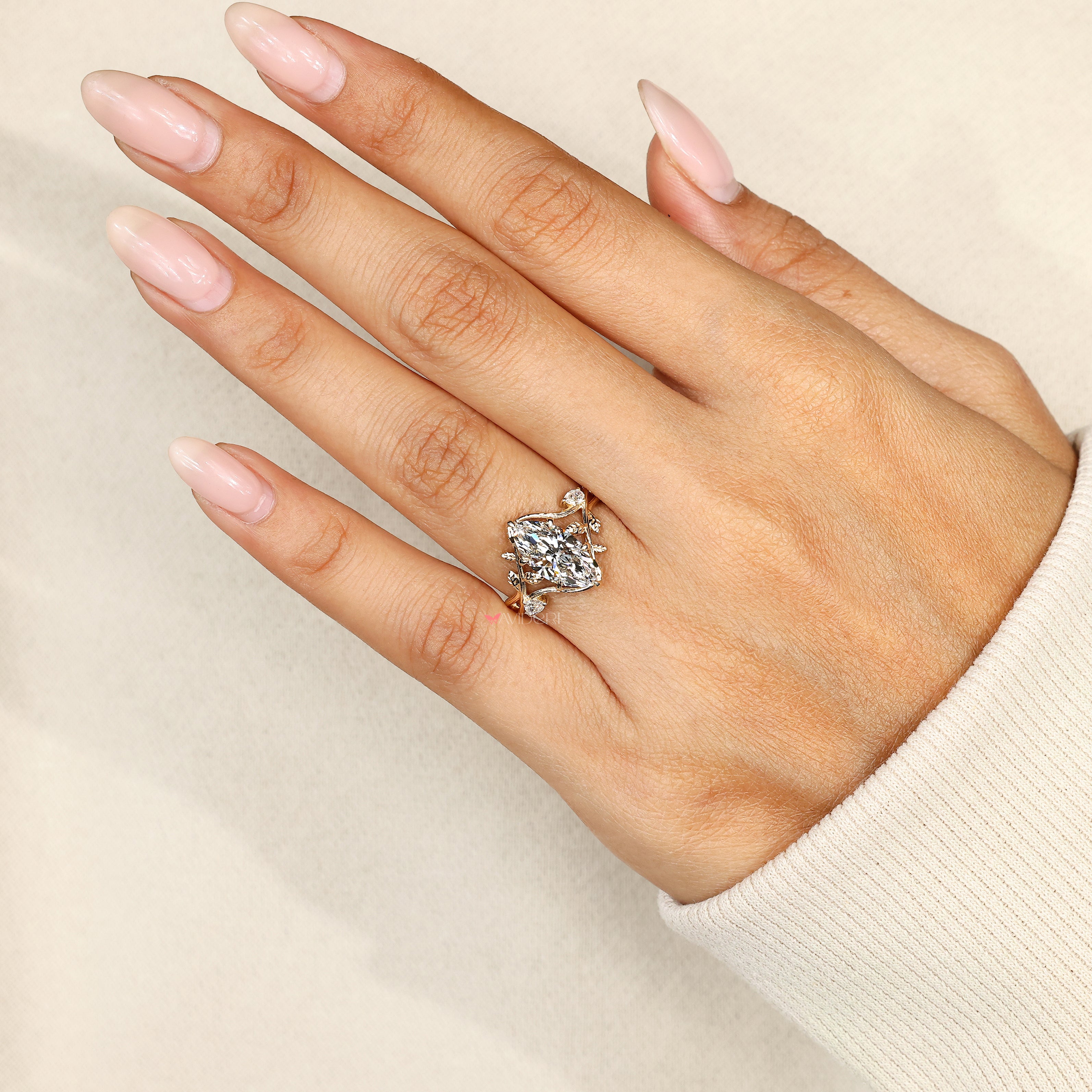 Vintage style marquise diamond ring with six claw setting

