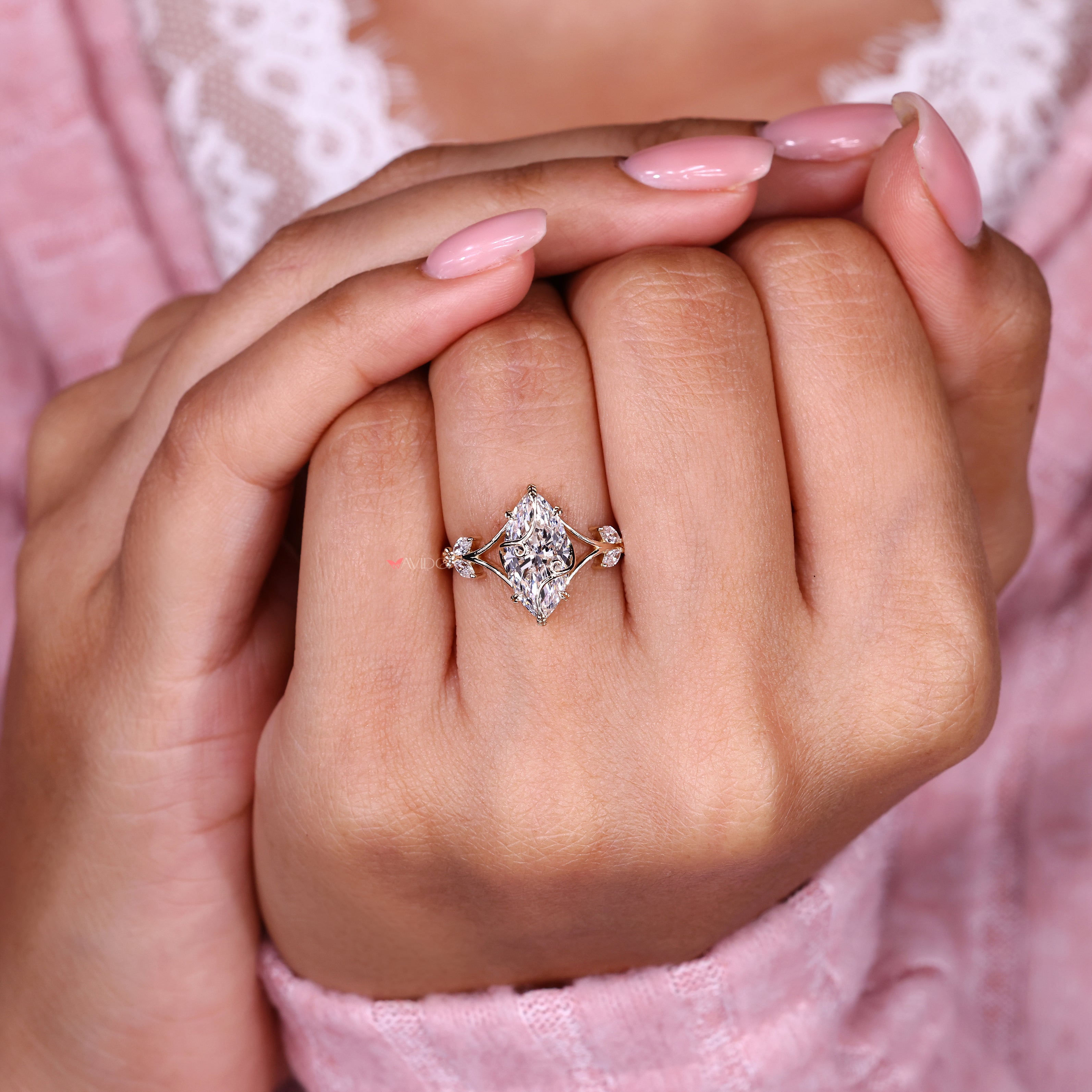 Marquise diamond ring with basket setting and split shank
