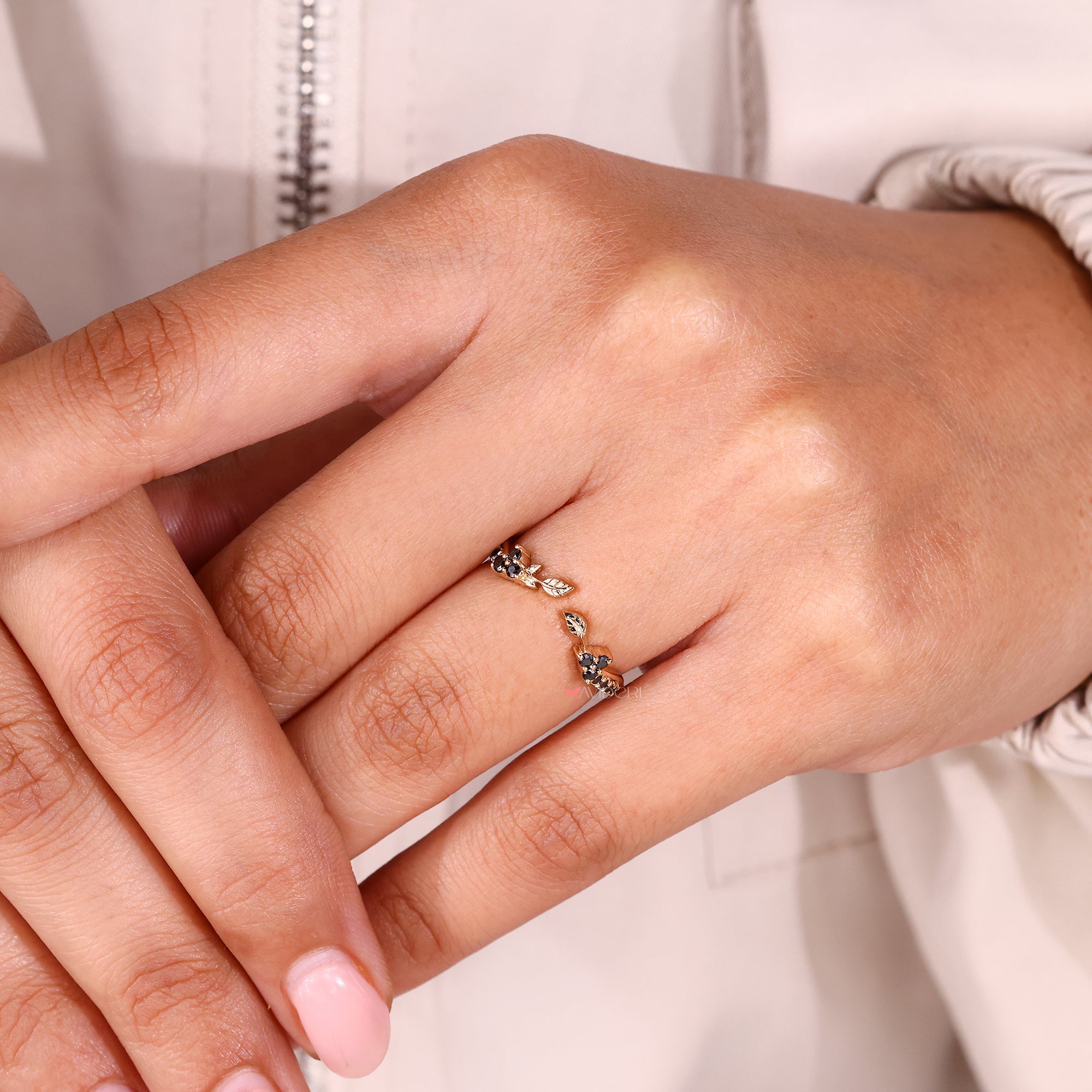 Handmade moissanite wedding band with nature inspired design in gold.