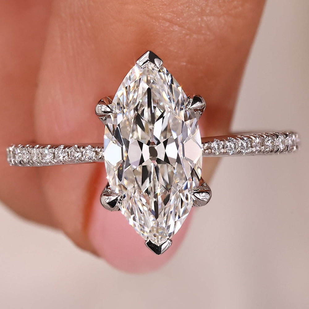 Old European cut diamond ring with pave setting in white gold.