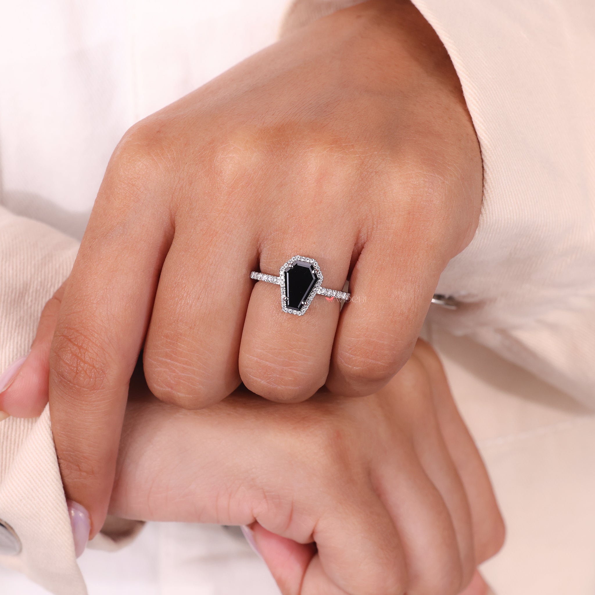 Coffin cut ring in white gold offers a modern and edgy style.