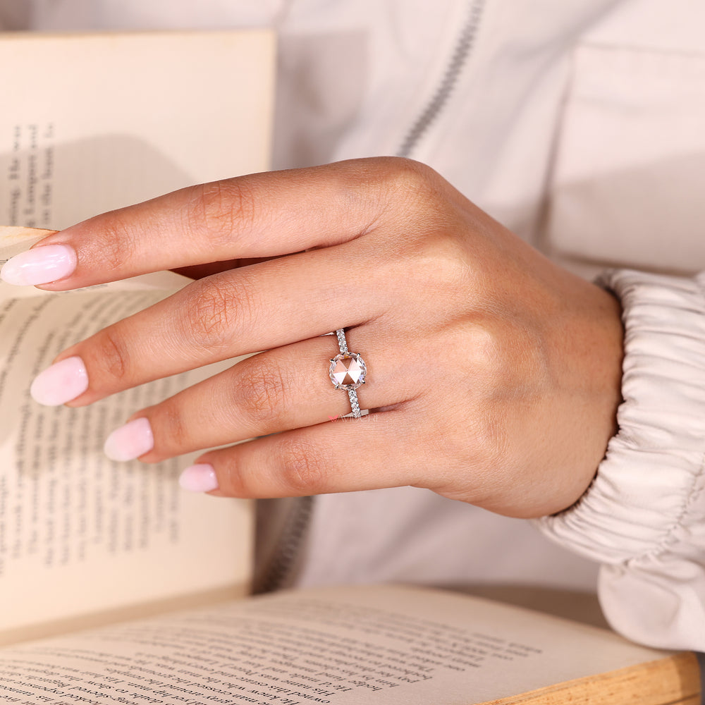 Rose cut diamond ring with round diamond pave band.
