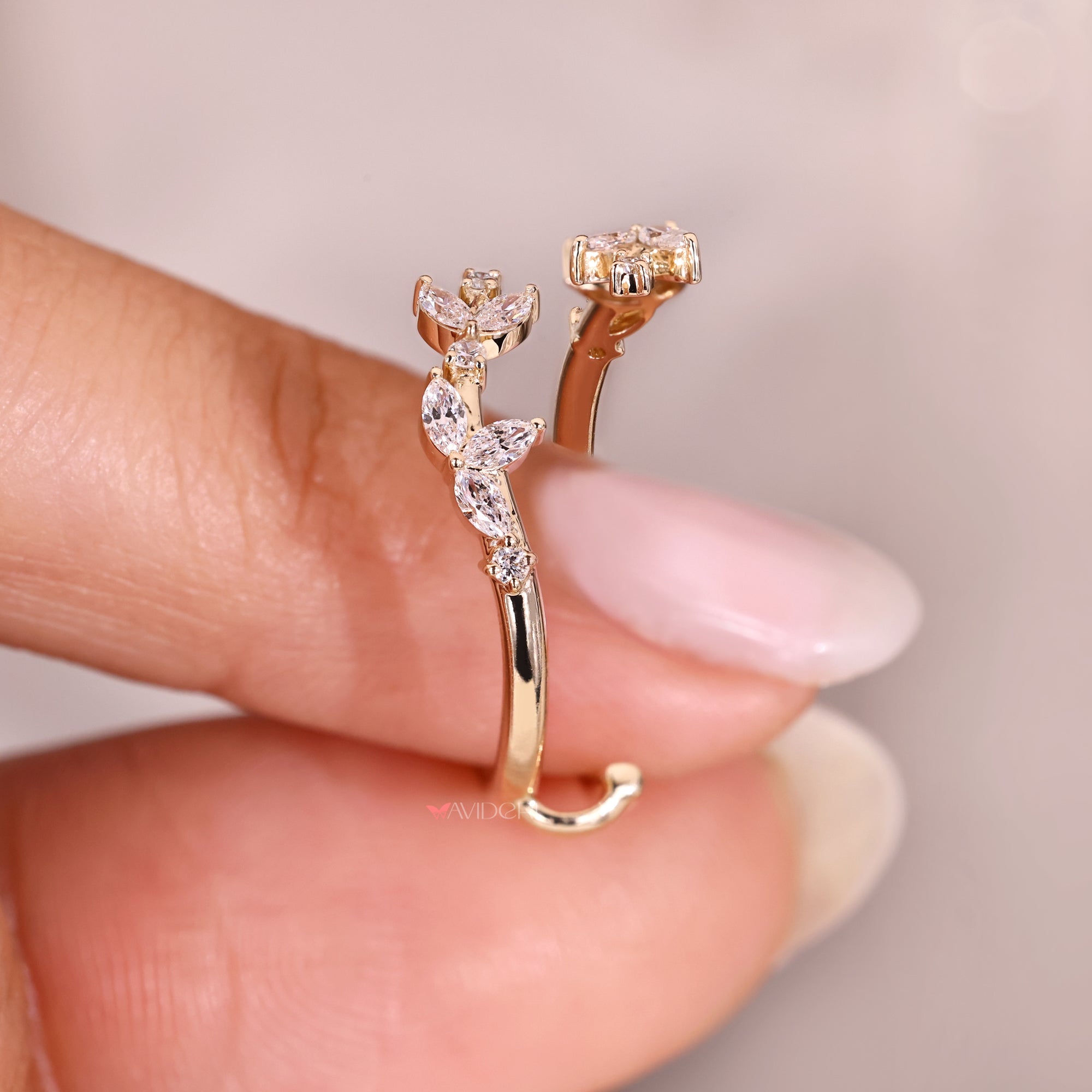 Floral marquise and round diamond enhancer ring.

