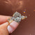 Oval cut diamond ring with pear round side stones.
