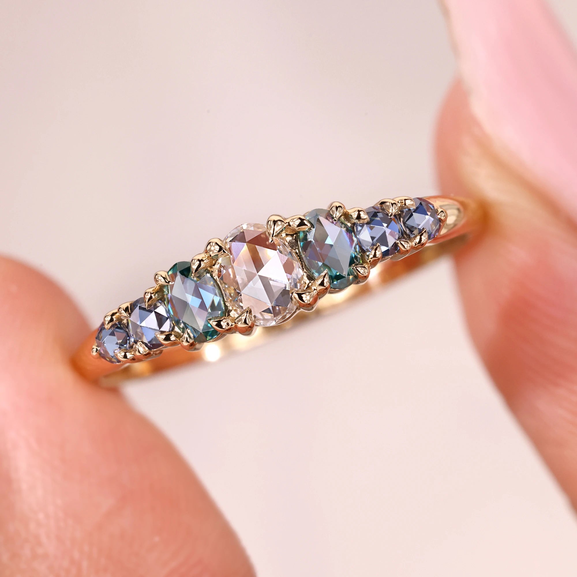 7 stone wedding band with 4 claw prong setting.