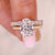 Oval diamond ring with solitaire style and diamond band.