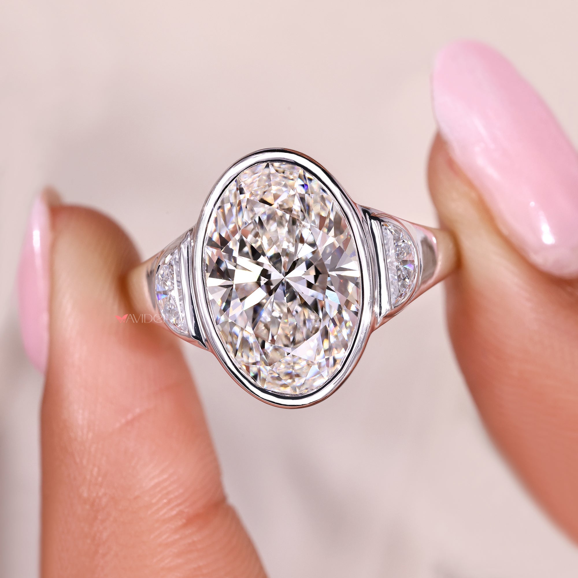 Three stone engagement ring with tapered shank design.