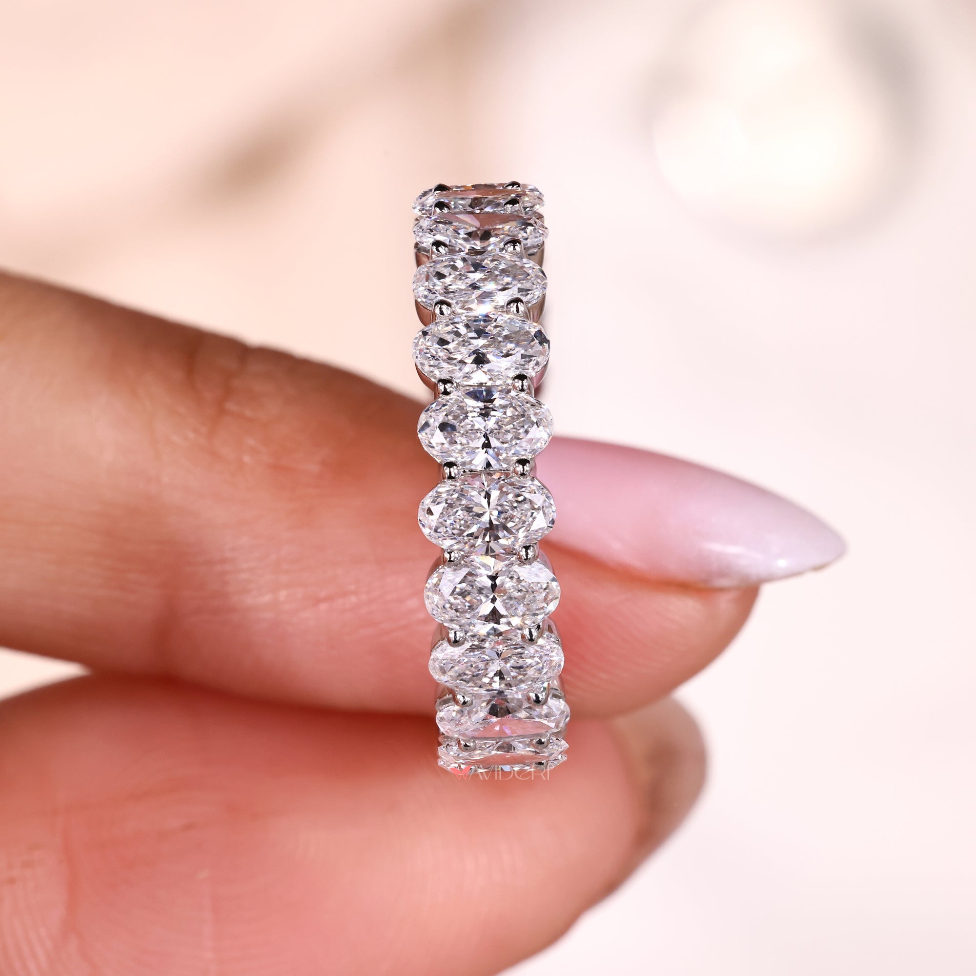 Full eternity band with oval diamonds.