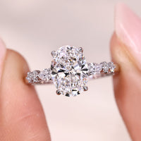 Oval Cut Seven Stone Diamond Ring With Pear Side Stones