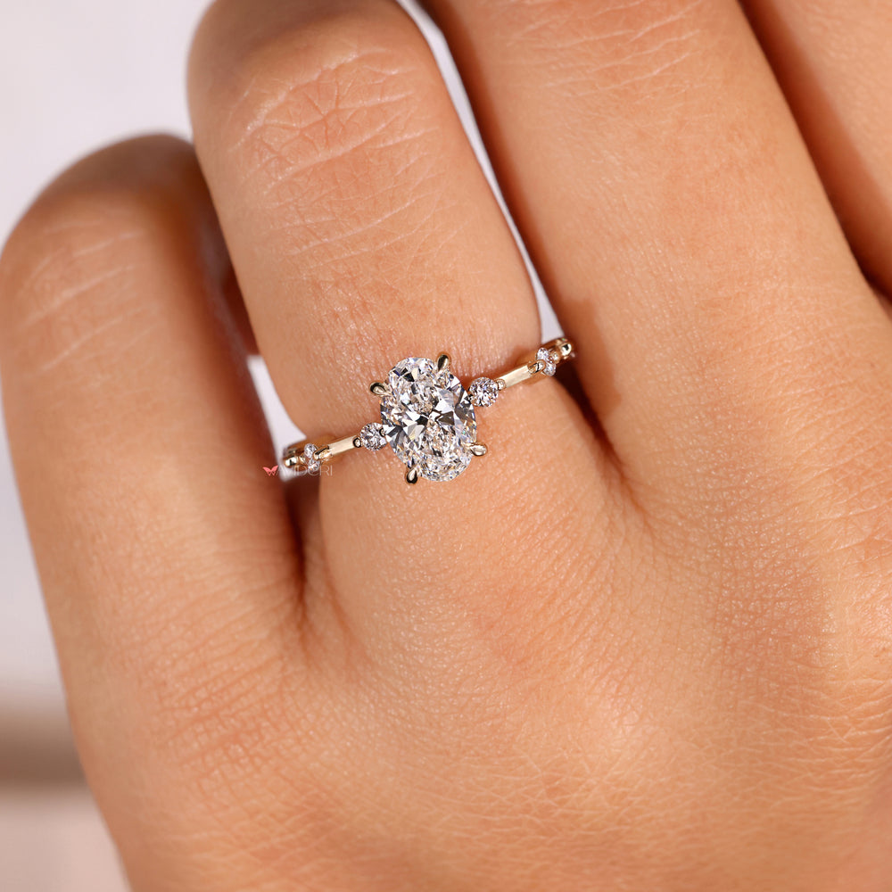 Oval diamond engagement rings with side stones showcasing a classic round diamond side stones design for timeless beauty.

