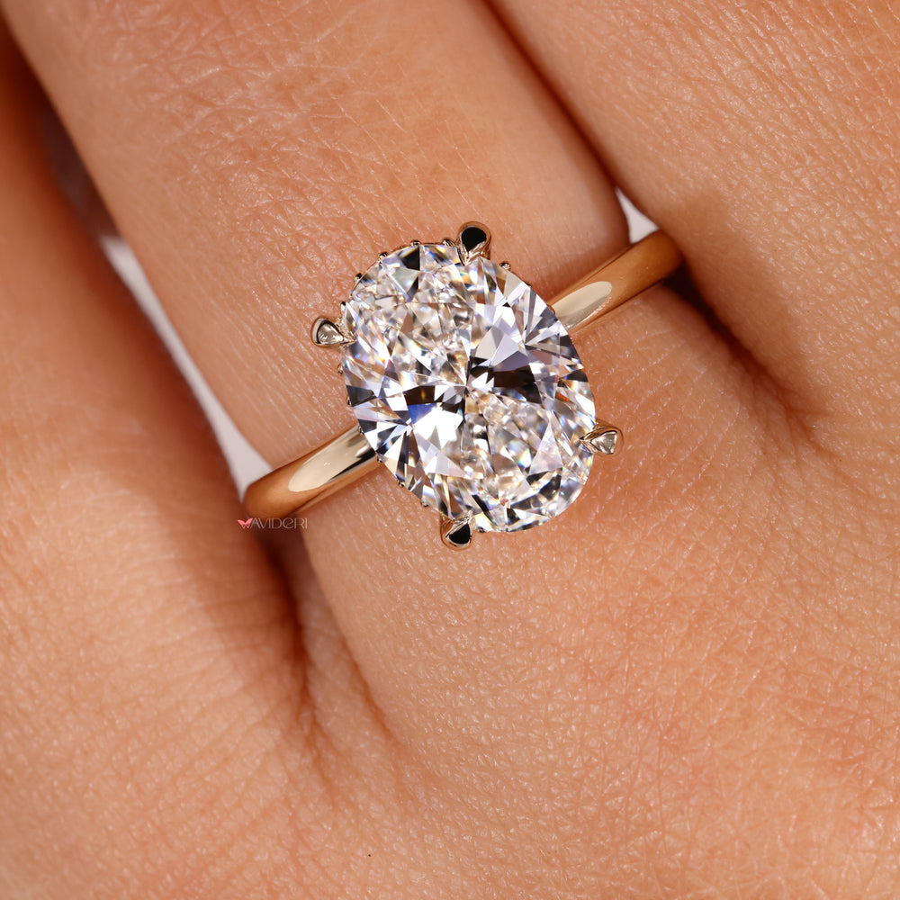 4 prong ring with a stunning Oval diamond to highlight its brilliance.
