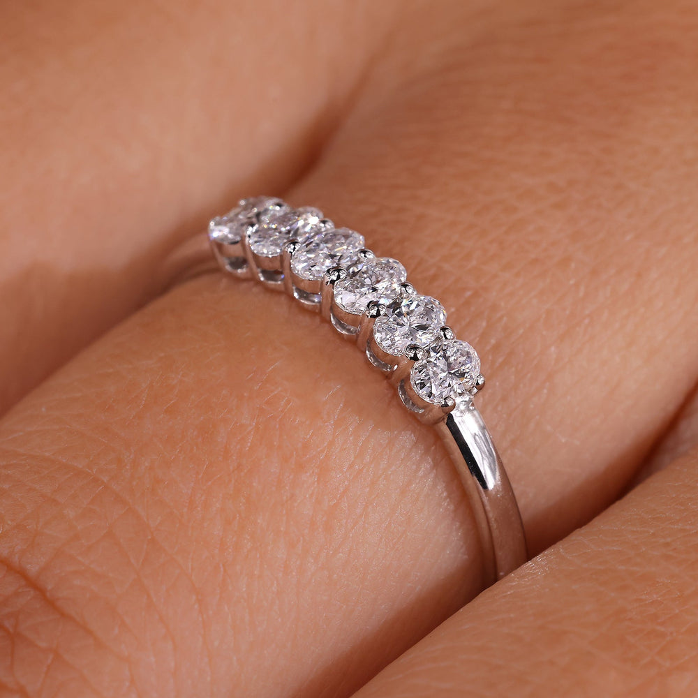 A six stone ring set in a sleek modern design.