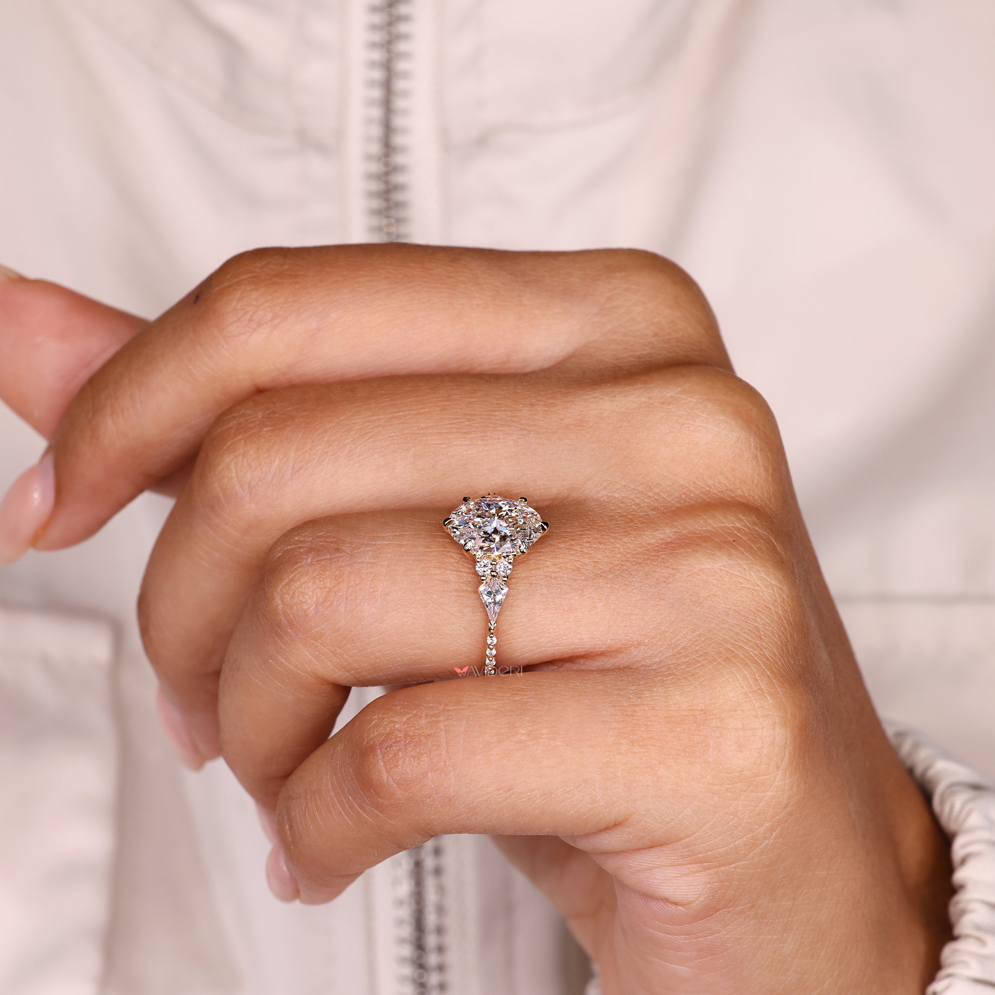 IGI certified oval ring with kite side stone accents
