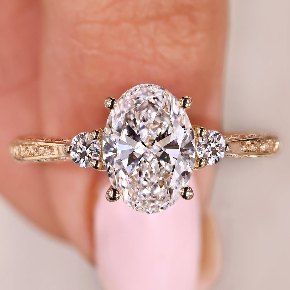 Handmade oval diamond ring with three stone arrangement
