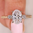 Handmade oval diamond ring with three stone arrangement
