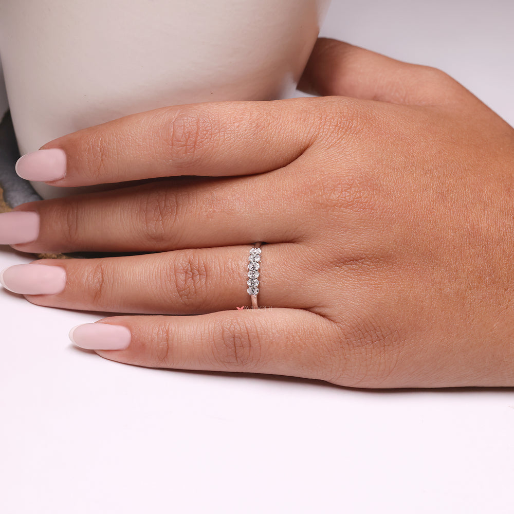 A shared prong wedding ring featuring precise craftsmanship.