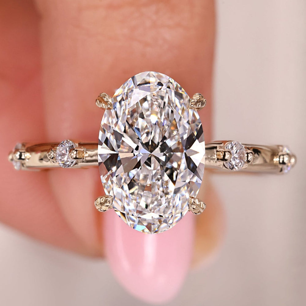 Oval diamond engagement ring shines with smooth oval shape.
