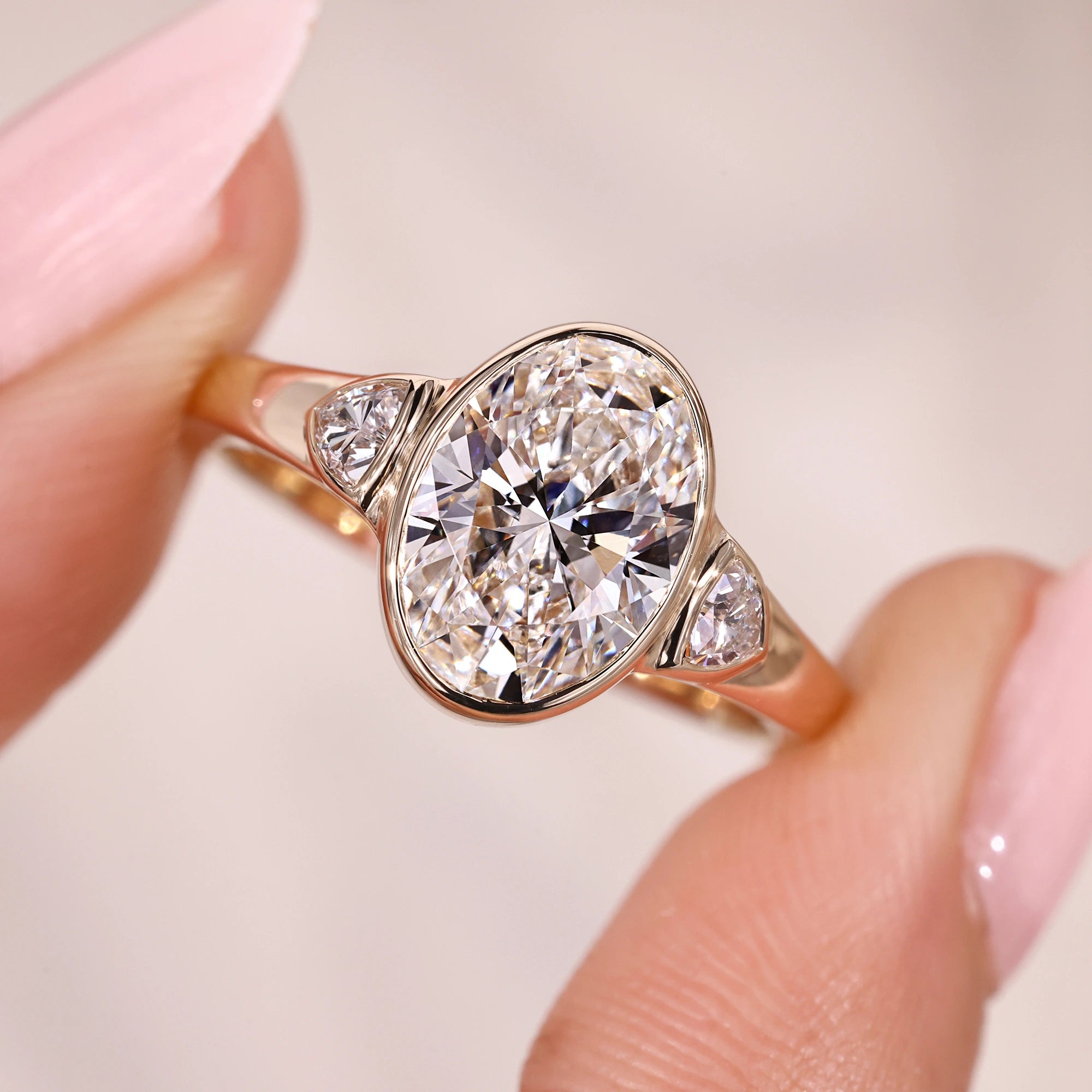 Three Stone Oval Engagement Ring In Yellow Gold