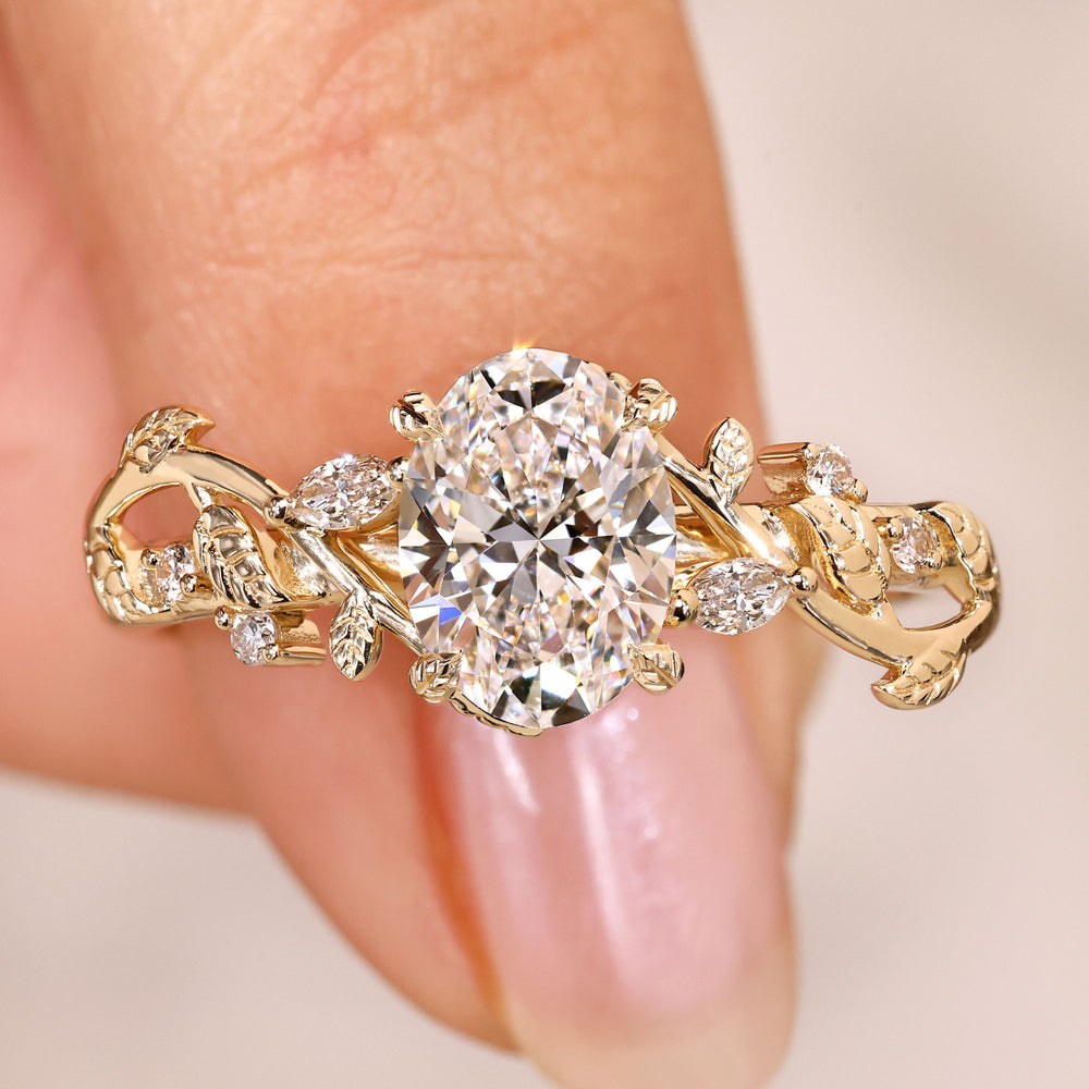 Oval cut diamond ring with marquise side stones.
