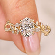Oval cut diamond ring with marquise side stones.
