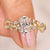 Oval cut diamond ring with marquise side stones.
