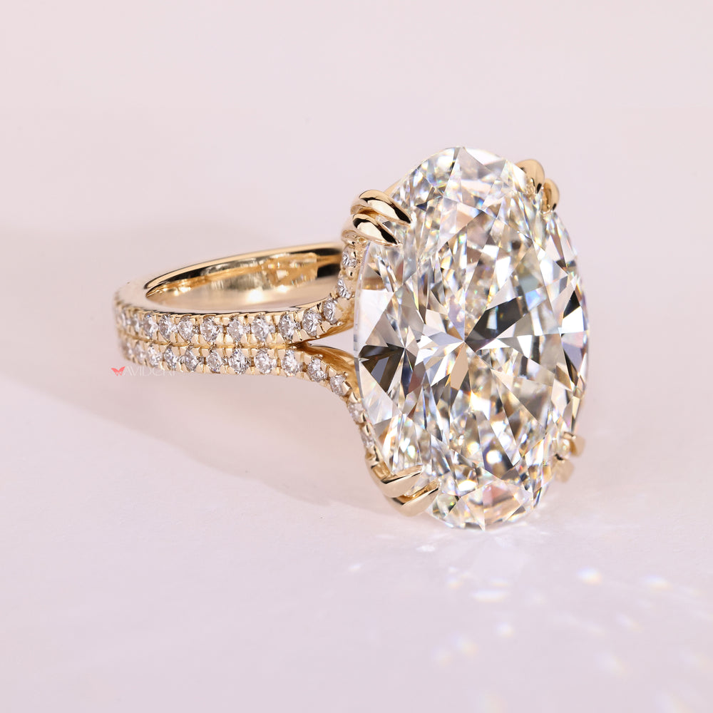 Oval diamond ring with double row pave band.
