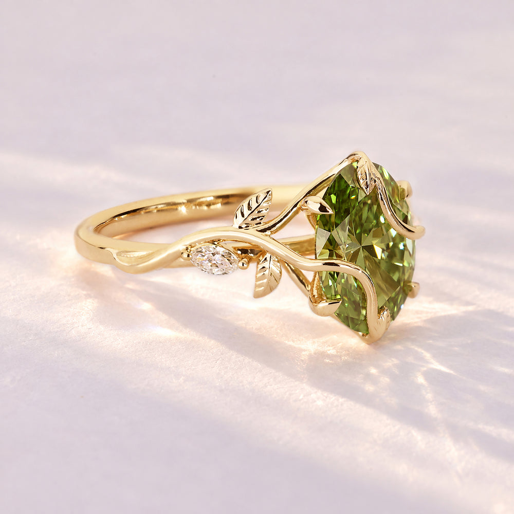 Oval diamond ring with nature inspired leaf prongs.