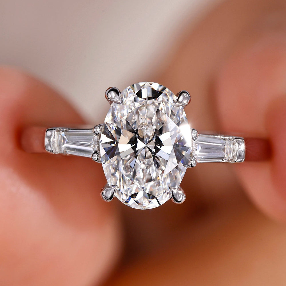Oval shaped engagement ring with an oval diamond wedding ring for elegance.
