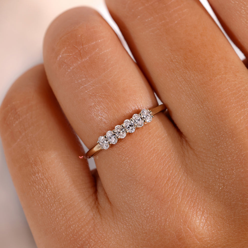 6 diamond wedding band featuring brilliant stones.
