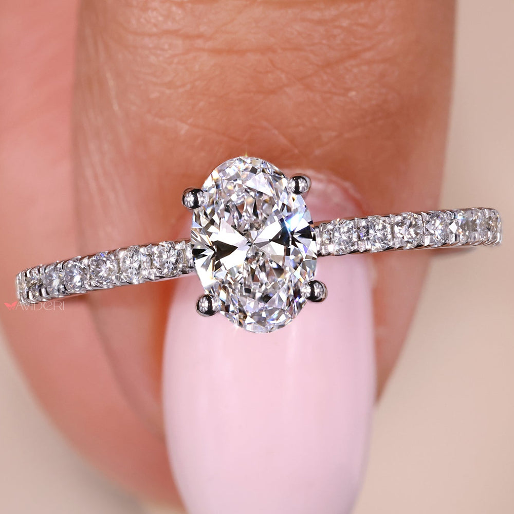 Oval shaped engagement ring set in a pave setting ring for extra sparkle.
