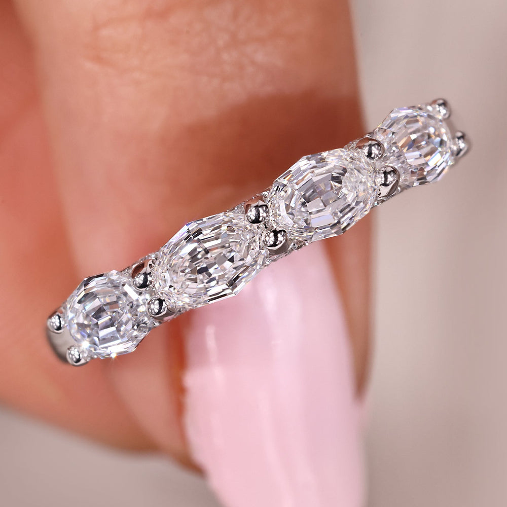 Shared prong wedding band in east to west setting.