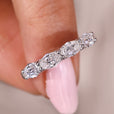 Shared prong wedding band in east to west setting.