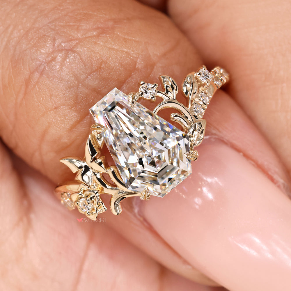 Round diamond pave coffin ring with leaf prongs.
