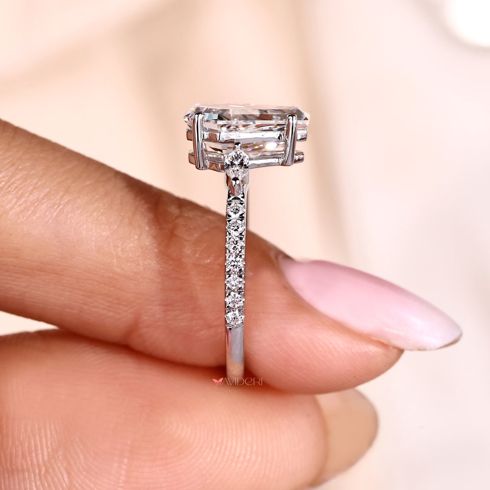 Coffin cut diamond ring with four prong setting.