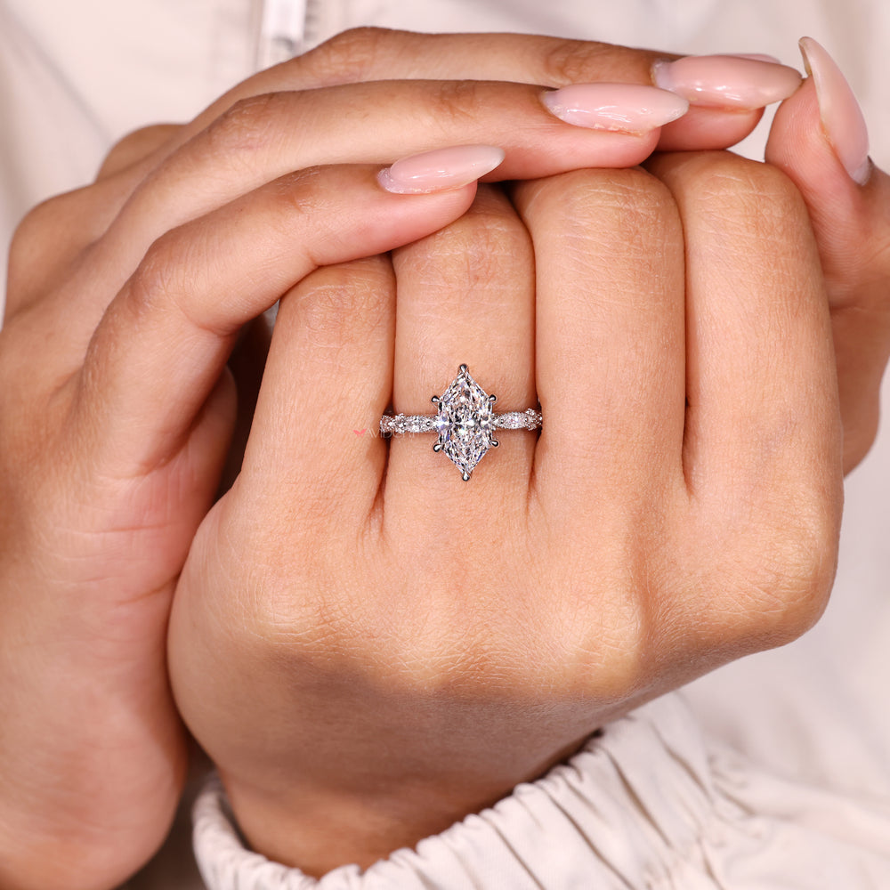 Dutch marquise ring with milgrain details and claw setting.
