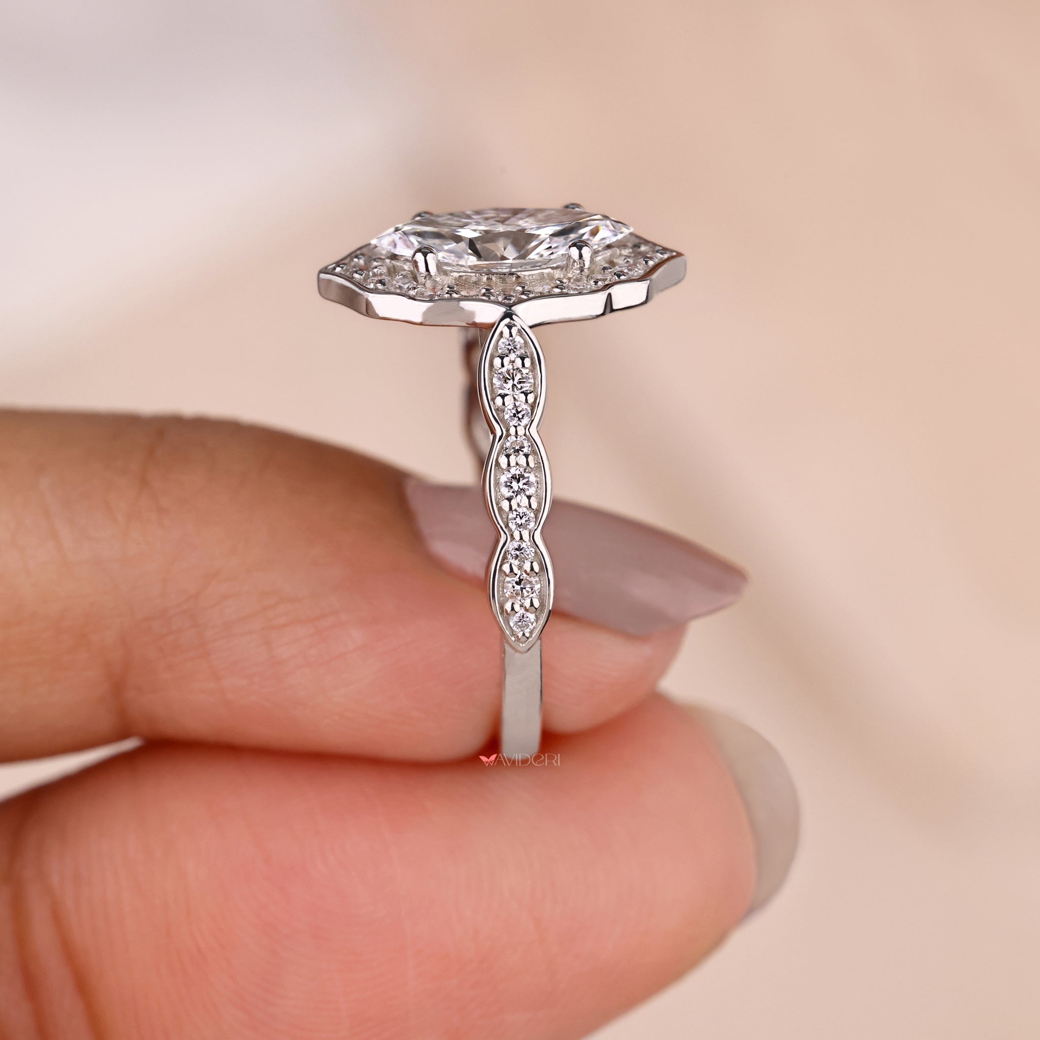 Round diamond engagement ring with a handmade ring design.
