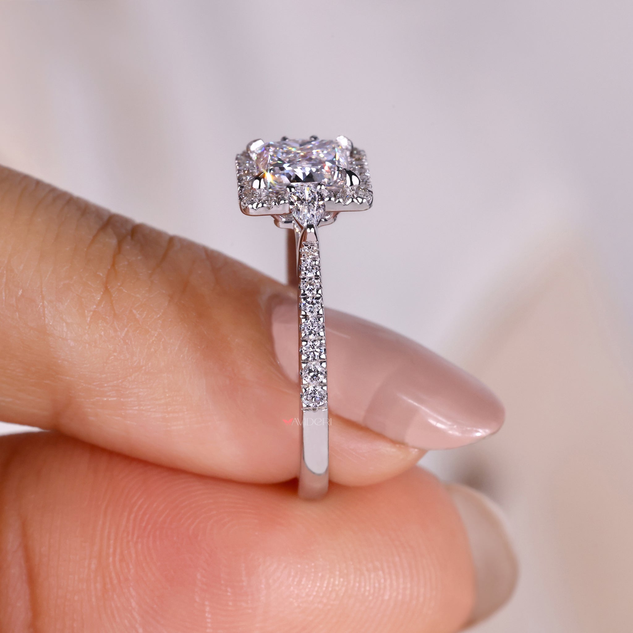 Pave setting with pavé diamonds enhancing the brilliance of the central princess cut diamond.
