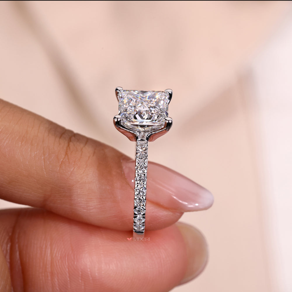 White gold ring with a princess cut diamond centerpiece

