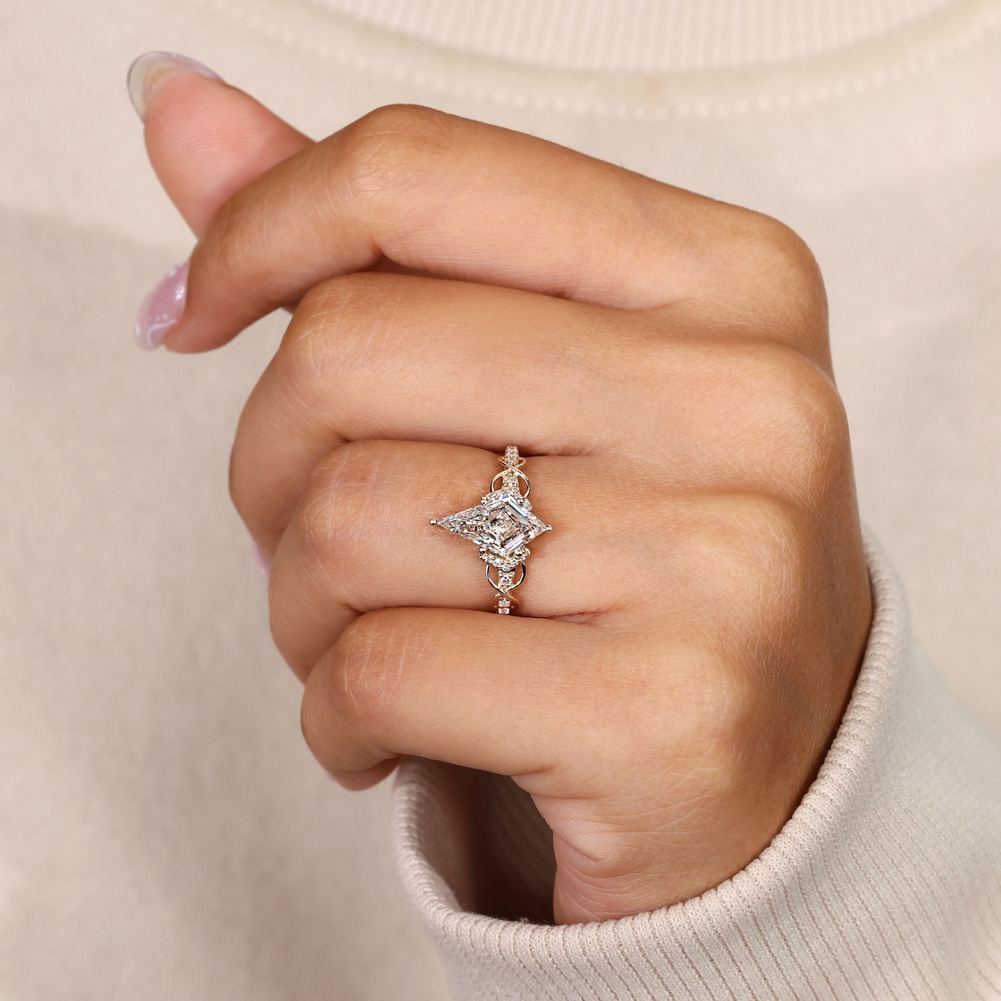 Lab grown kite cut diamond ring with round pave.
