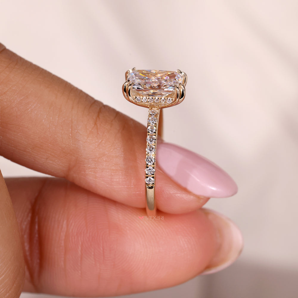 Pave diamond ring with intricate claw prong setting craftsmanship.
